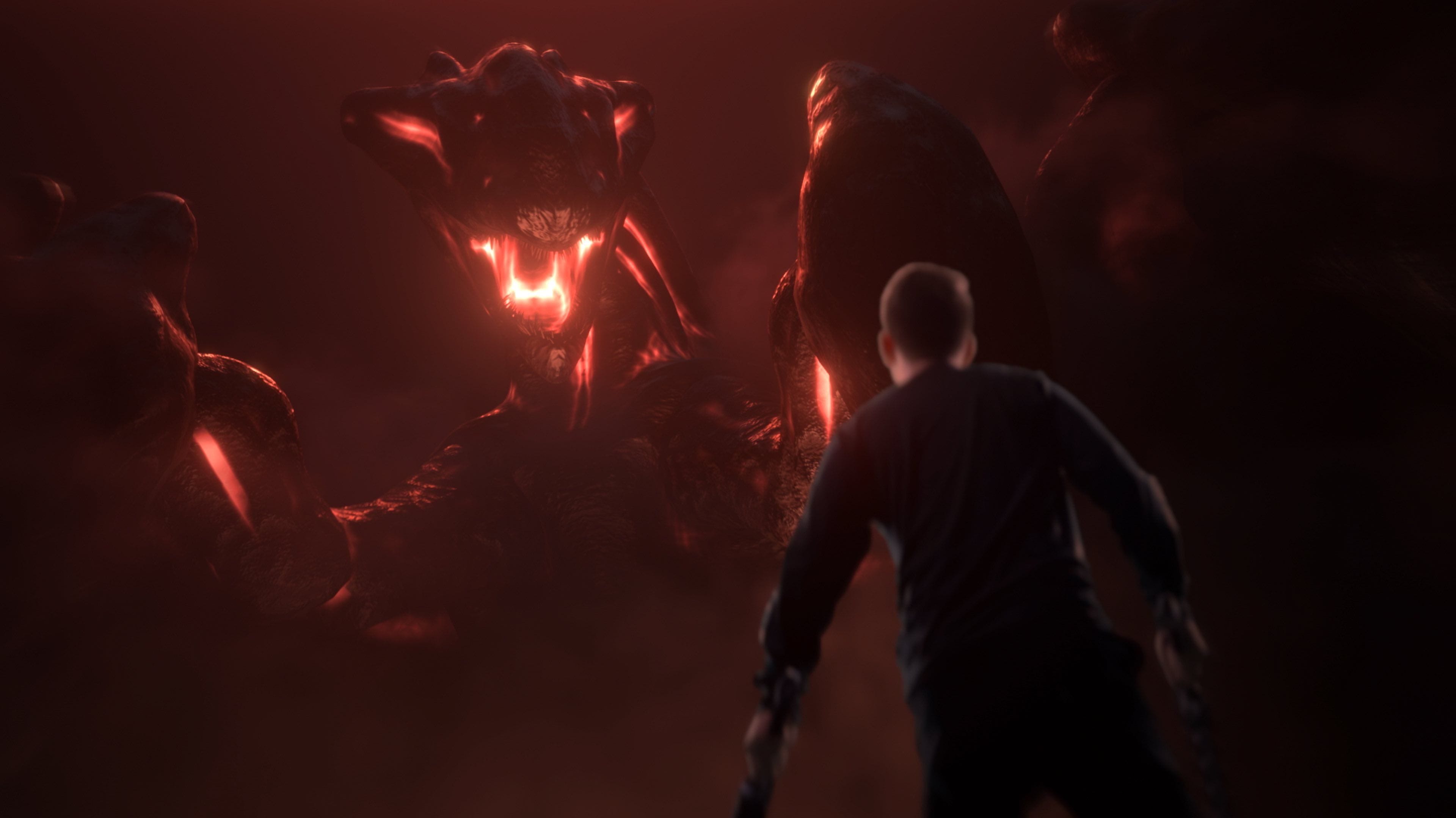 From behind, a person confronts a colossal, multi-limbed creature with a glowing red mouth in a dark, smoky red setting.
