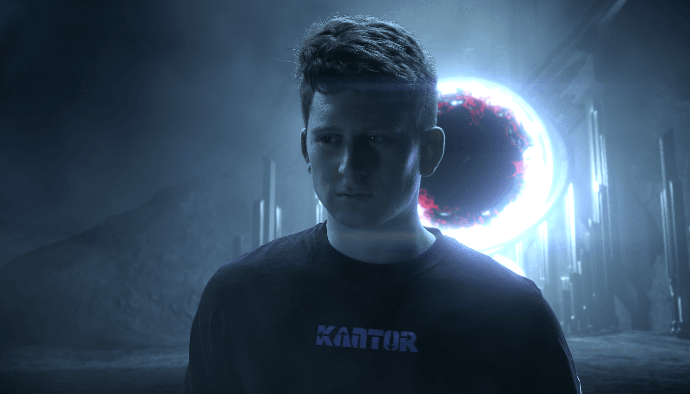 A young man wearing a "KANTOR" t-shirt stands contemplatively in a dark, misty sci-fi landscape with towering structures and a brightly glowing, chaotic energy portal behind him.