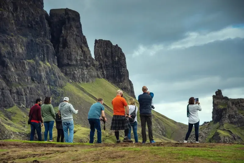 People standing on a ridge on a Hairy Coo Tour